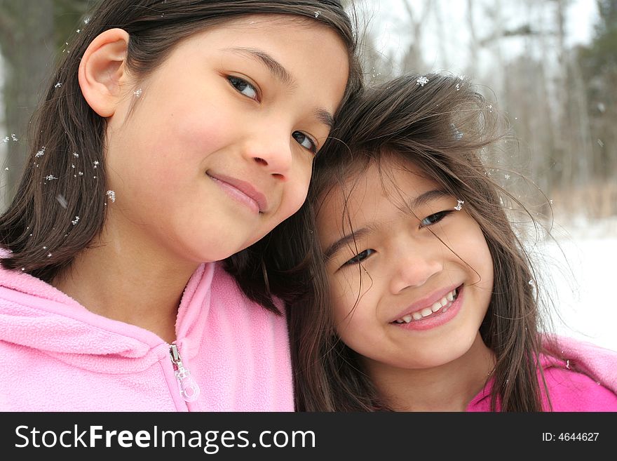 Two sisters enjoying the utdoors in winter. Two sisters enjoying the utdoors in winter