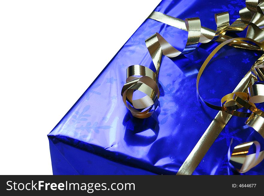 Shiny blue gift with gold ribbons