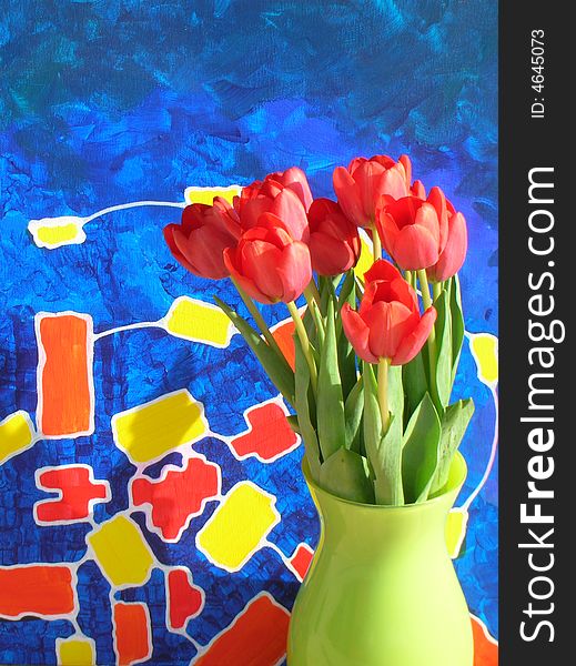 An old painting I did photographed with red tulips in green vase. An old painting I did photographed with red tulips in green vase.