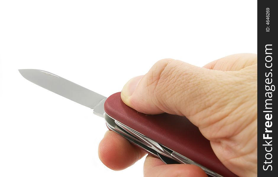 Hand with a penknife isolated on white