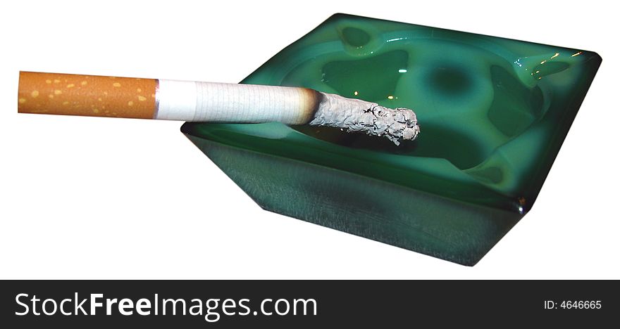 Close up of smoking cigarette in ashtray