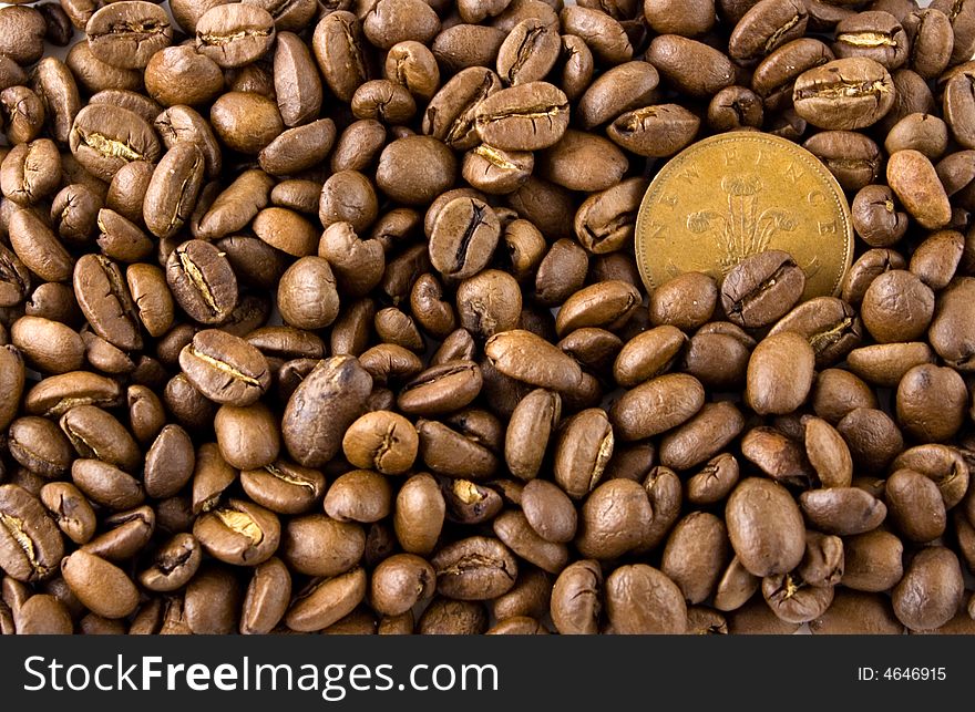 Some coffee seeds and the coin