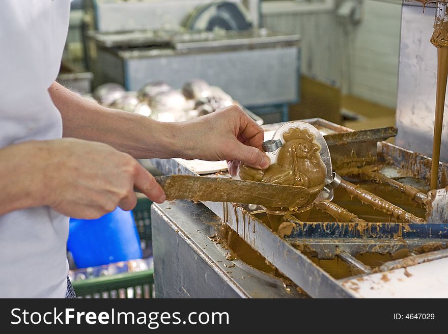 Making chocolate in a bakery. close-up of hands.