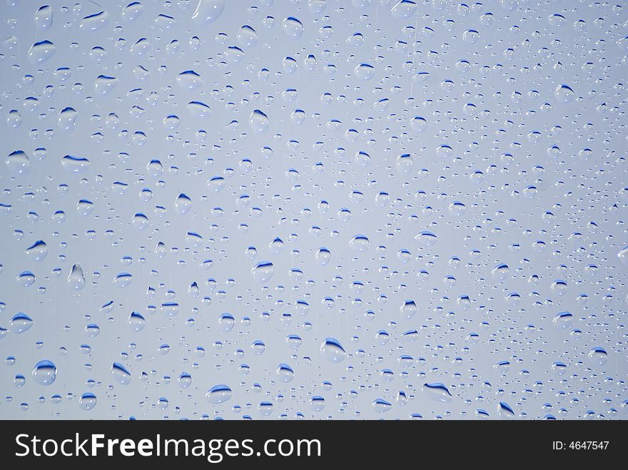Little water drops on the blue background