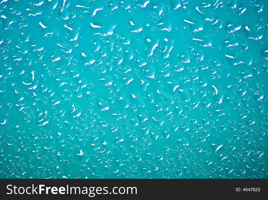 Water drops on the blue background