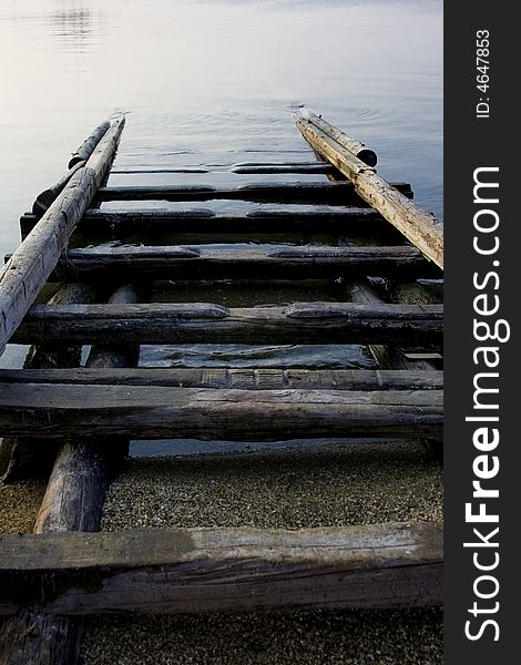 Wooden boat ramp leading into the water