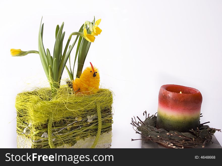 Chick in basketry with some flowers and candle - for Easter celebration. Chick in basketry with some flowers and candle - for Easter celebration.
