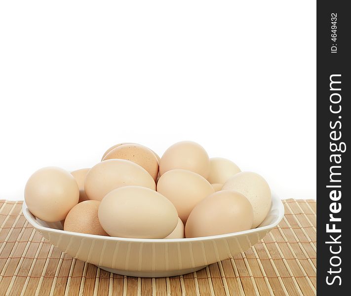 Eggs in a plate isolated on white background