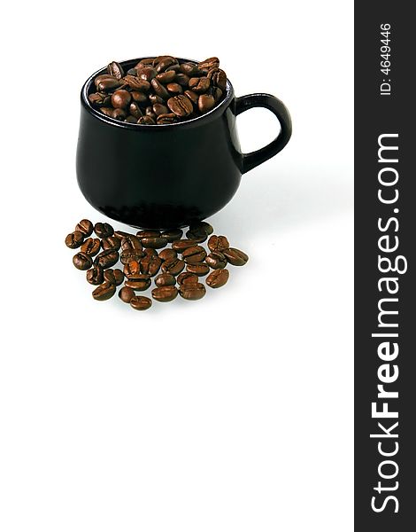 Coffee beans in a little brown cup on a white background. Coffee beans in a little brown cup on a white background