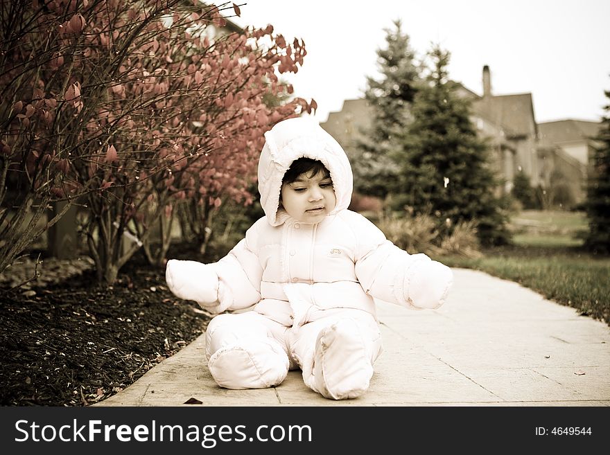 Picture of a child wearing snowsuit during winter. Picture of a child wearing snowsuit during winter