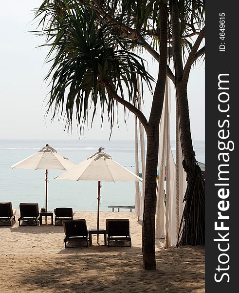 Deck chairs and umbrellas on the beach. Deck chairs and umbrellas on the beach.