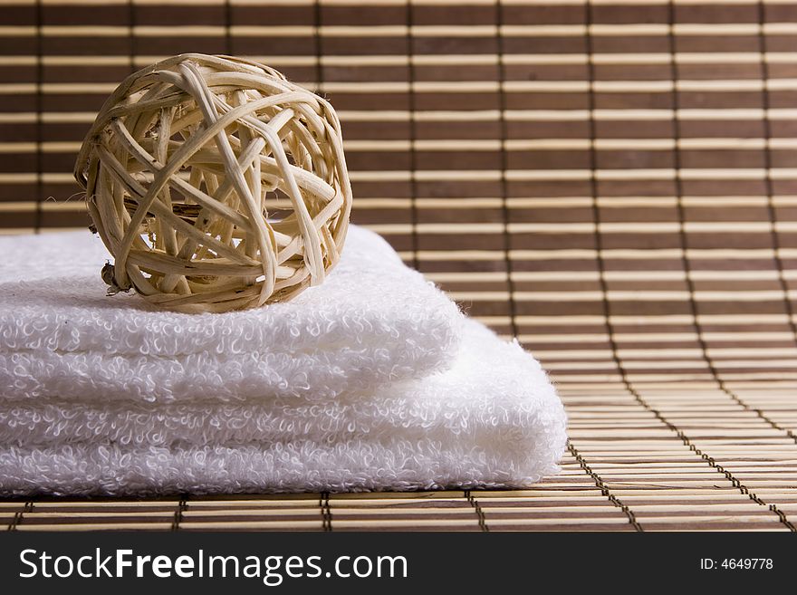 Two white towels on the desk and sphere