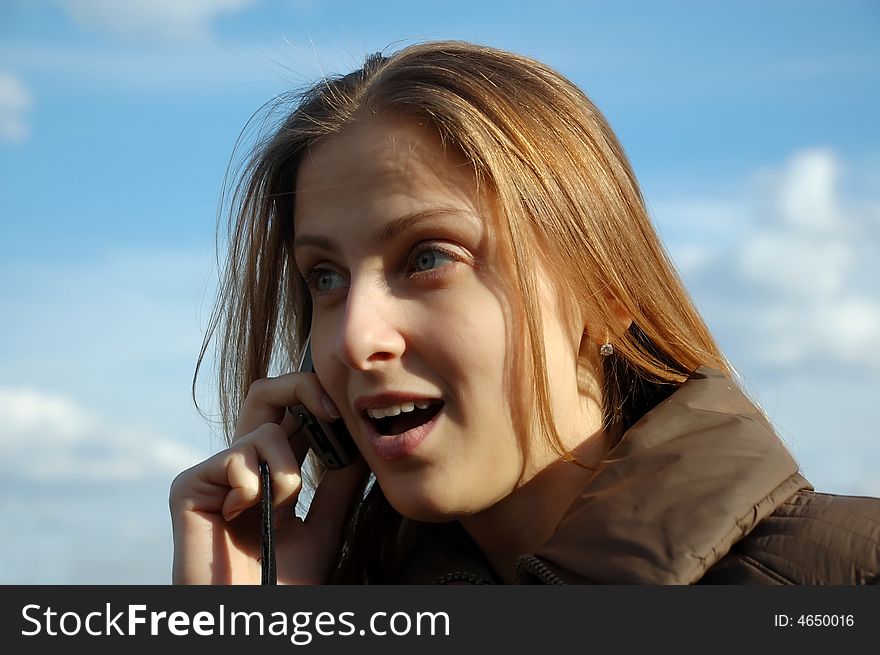 Pretty woman calling on phone outdoor