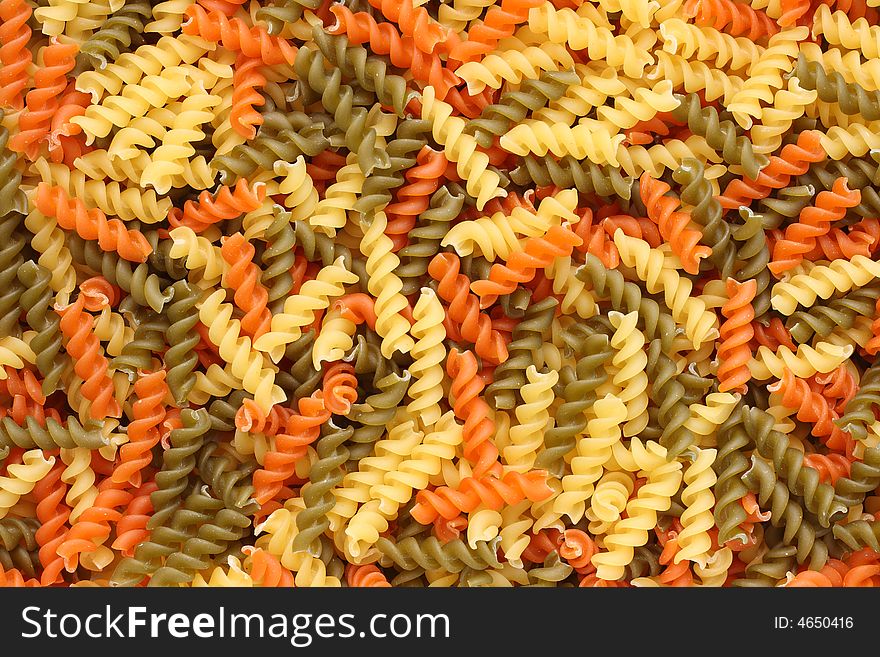Colorful fusilli pasta background