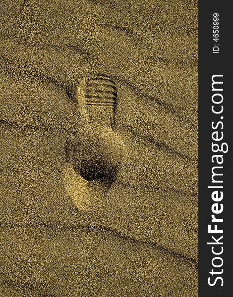 Detail of a footprint in the sand