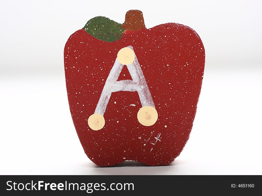 Wooden Apples with the letter A painted on it. Wooden Apples with the letter A painted on it.