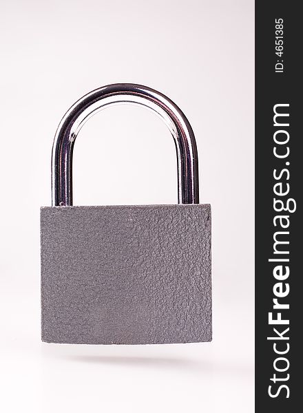 Metal padlock over white background