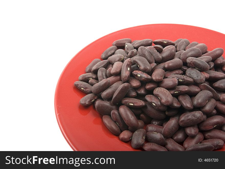 Red beans in the red plate on white background