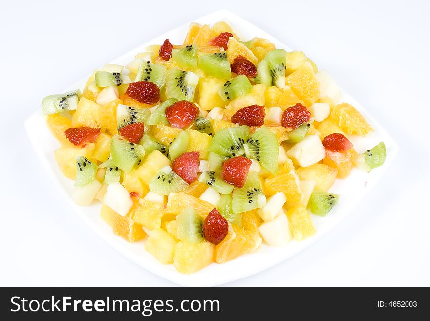 Salad from fresh appetizing fruit on a white background. Salad from fresh appetizing fruit on a white background.