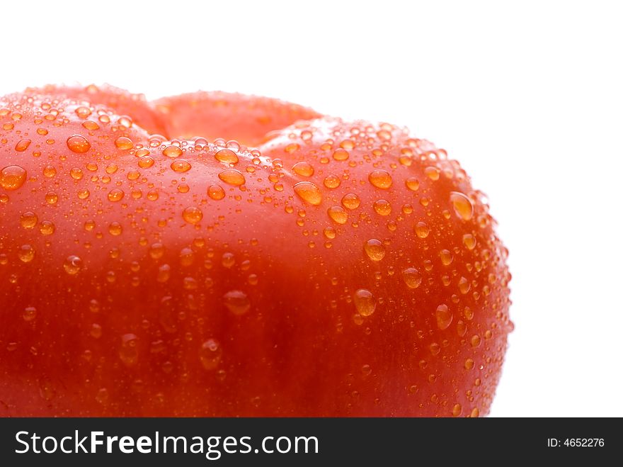 Macro of a fresh red tomato on a white background