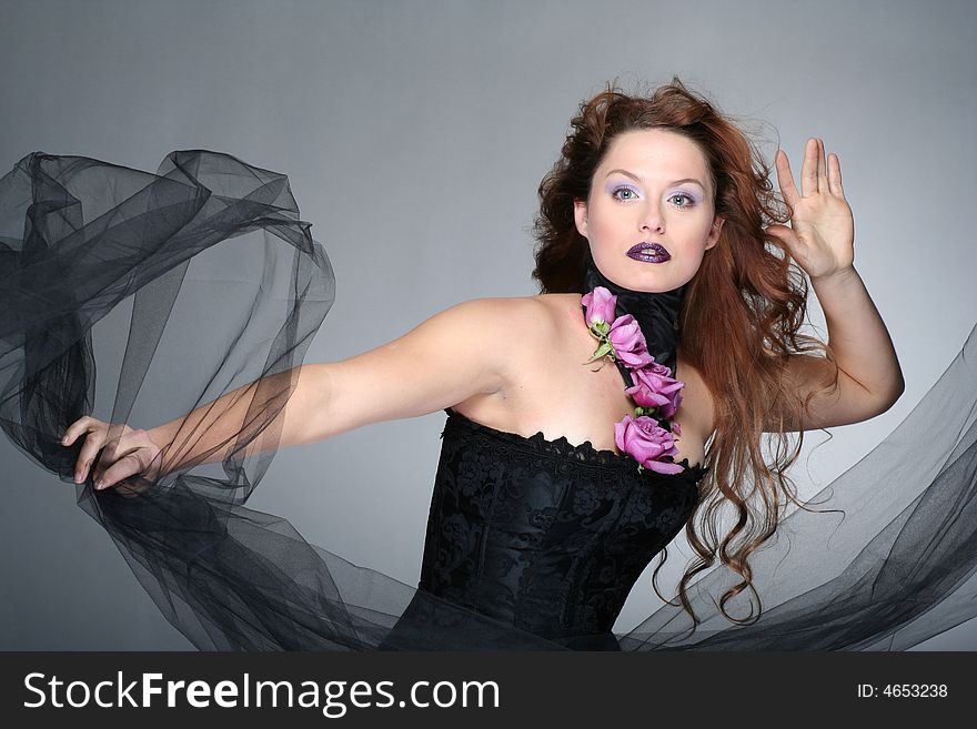 Portrait of young woman with red hair