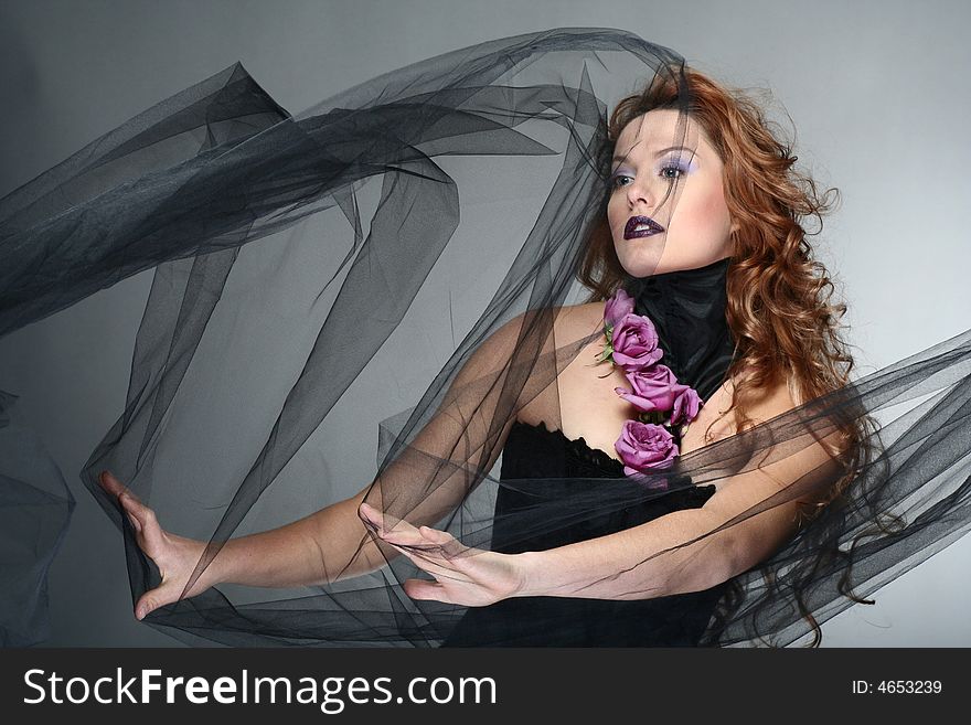 Portrait of young woman with red hair