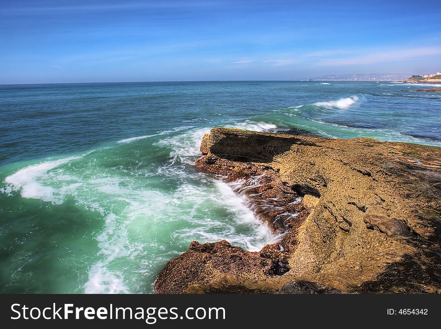 Water crashing onto a rocky beach