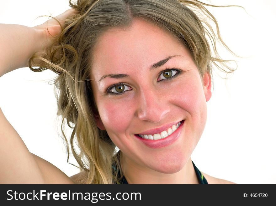 Young smiling lady curling her hair