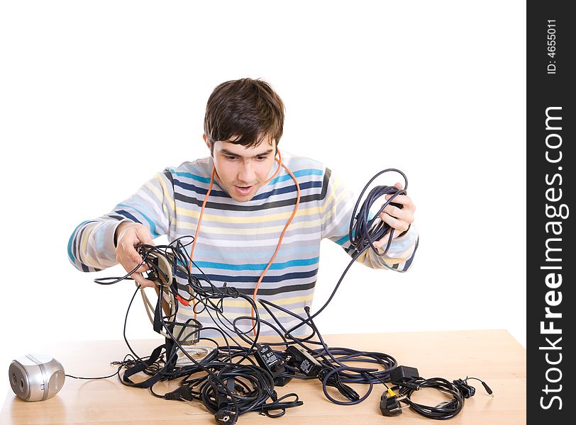 The young guy with cables isolated on a white