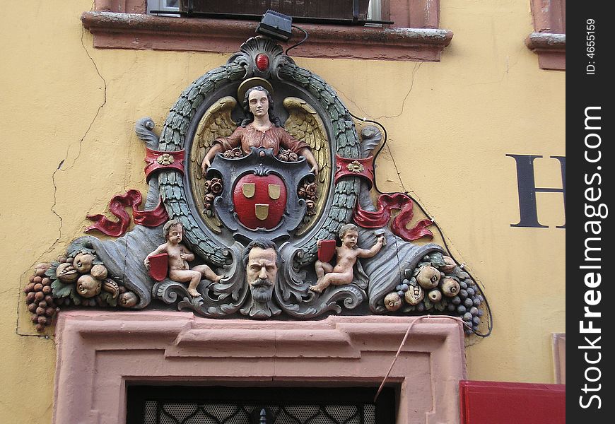 The heraldic figure of the old Hotel Goldener Hecht in Heidelbergs old part