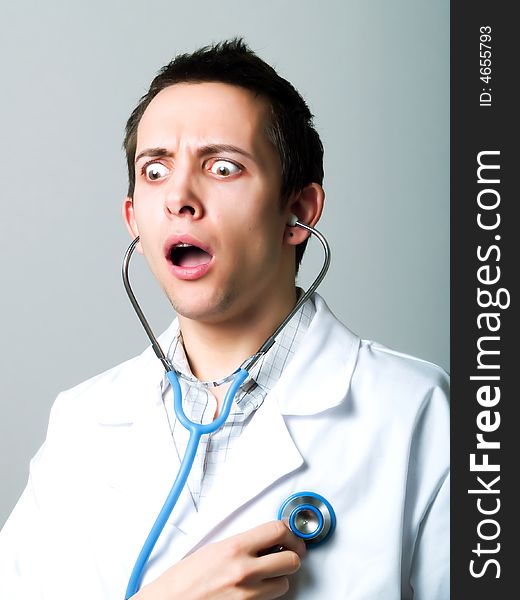 Young doctor using a stethoscope