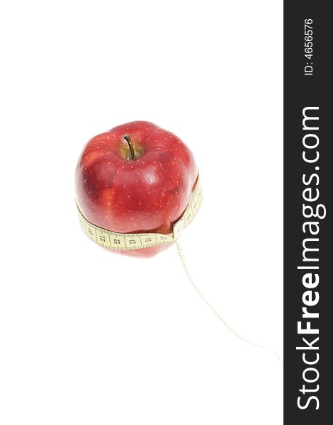 A red apple with measuring tape on its body. A red apple with measuring tape on its body