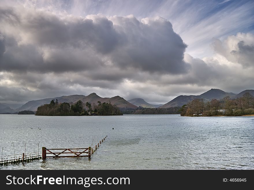 A Submerged fence on the shore of derwentwater in the English lake district. A Submerged fence on the shore of derwentwater in the English lake district