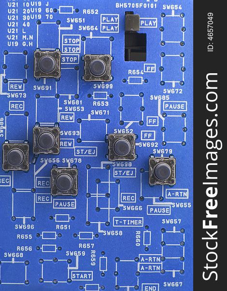 Blue Circuit board with lots of writing and buttons. Blue Circuit board with lots of writing and buttons