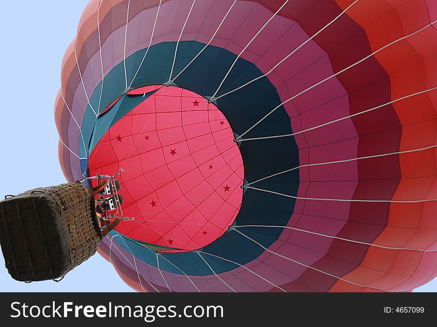 Red & pink colored balloon descends