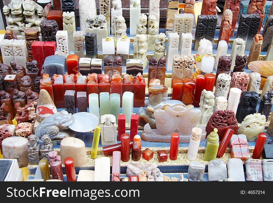 Beijing,China,one of stall of antique market,a lot of chinese carving seals on sale.