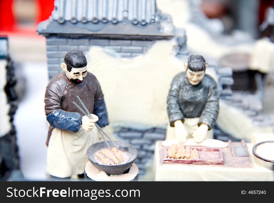 Chinese cartoon figurine,businessmen saling food in old Beijin street. porcelain,traditional,handmade. Chinese cartoon figurine,businessmen saling food in old Beijin street. porcelain,traditional,handmade.