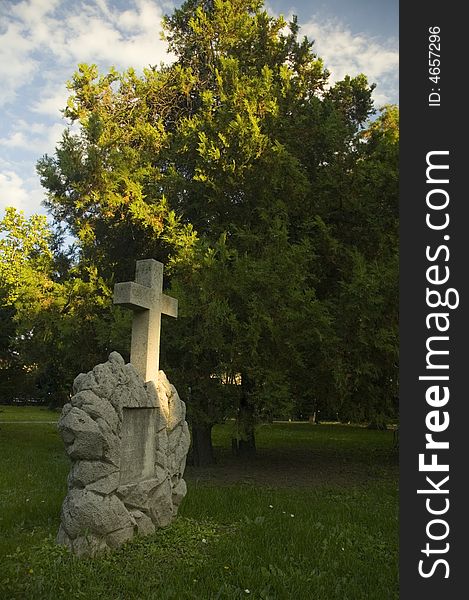 Religious cemetery with fresh green trees and grass