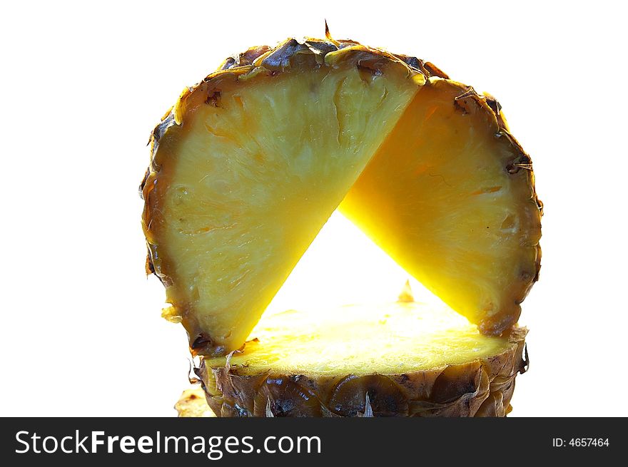 Pineapple cut on a part on a white background isolated. Pineapple cut on a part on a white background isolated