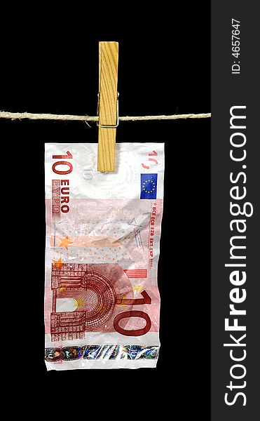 A ten euro note hanging from a clotheline. A ten euro note hanging from a clotheline