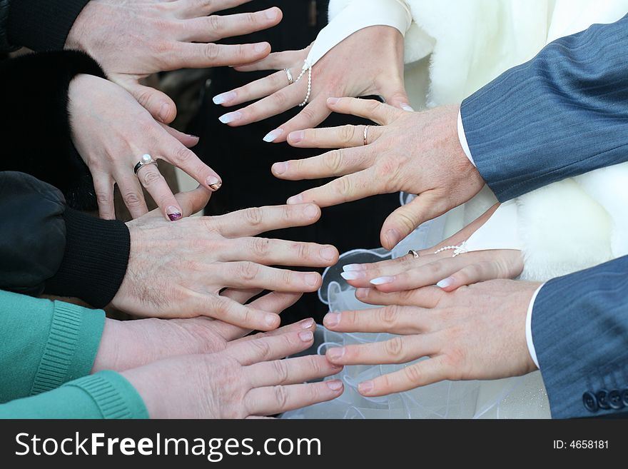 Five friends have connected hands as a token of friendship. Five friends have connected hands as a token of friendship