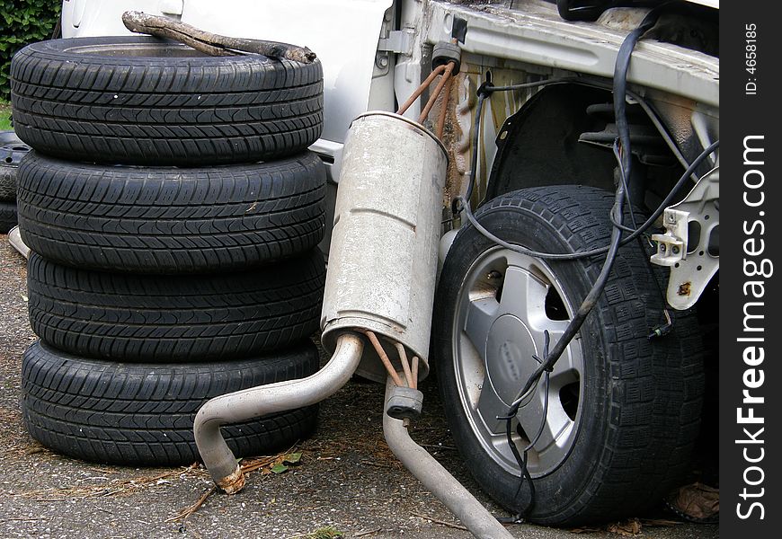 A wreck and some parts of car