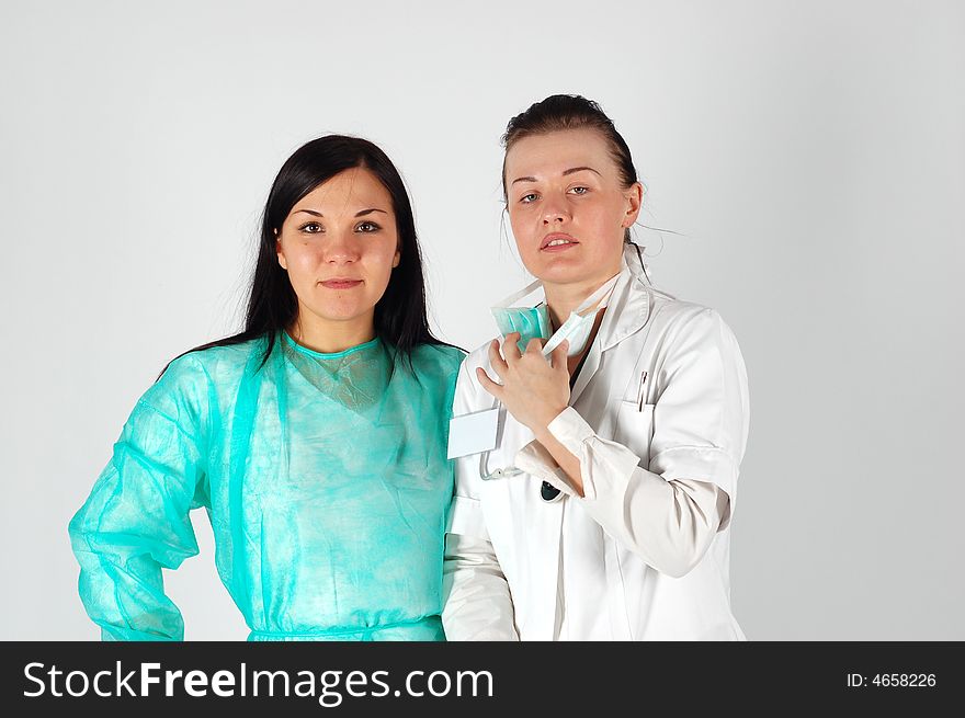 Two attractive brunette women in uniforms. Two attractive brunette women in uniforms