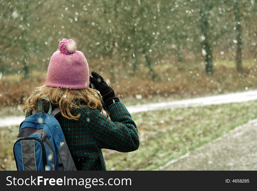 Girl Taking Photos Of The Snow