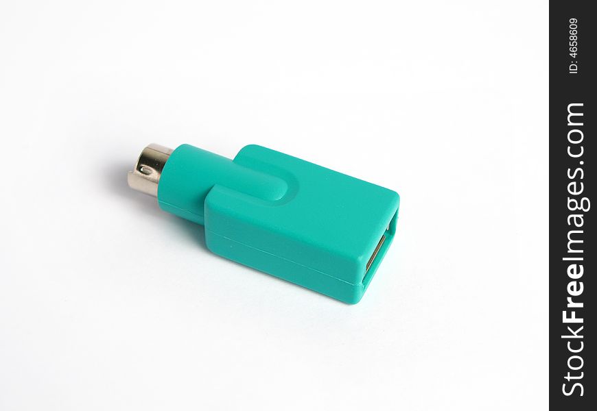 Green usb to ps2 connector in a white background. Isolated photo.