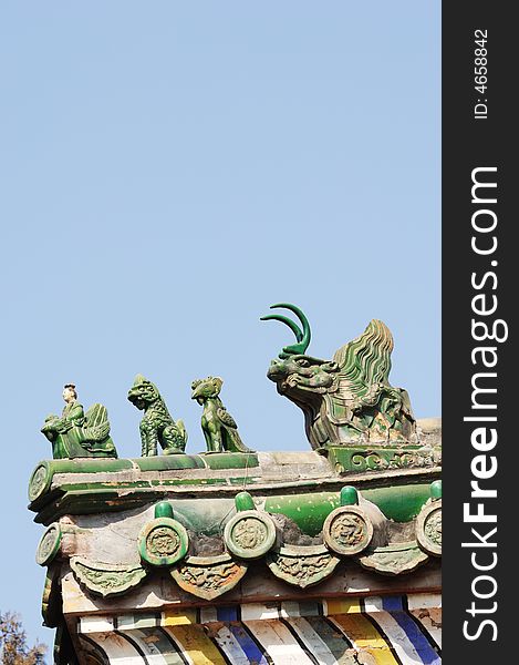 Eave of the Chinese ancient building. with creatural sculpture.vertical composition of a picture. Eave of the Chinese ancient building. with creatural sculpture.vertical composition of a picture