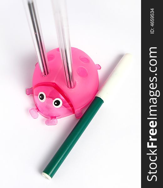 Pink Ladybug Pencil Holder, with pens and marker on white background