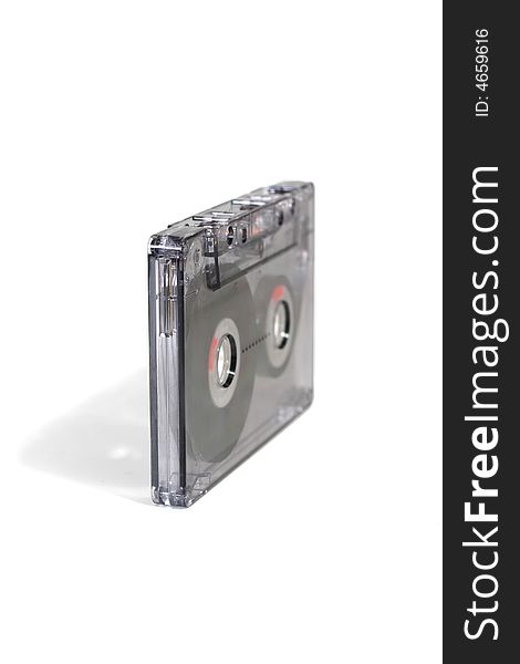 Black, transparent audiocassette on a white background