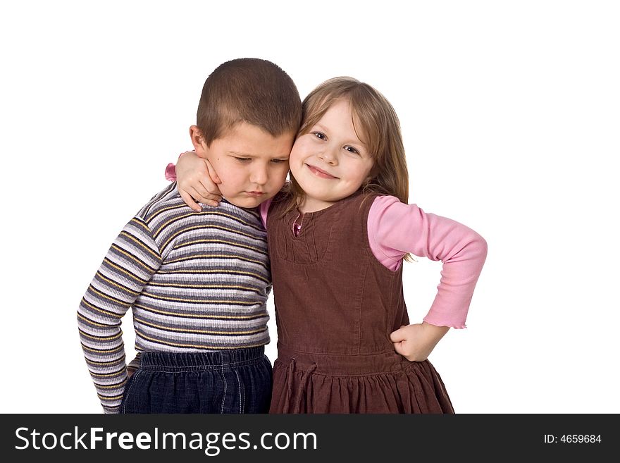 Children on a white background, the joyful girl embraces the sad boy. Children on a white background, the joyful girl embraces the sad boy