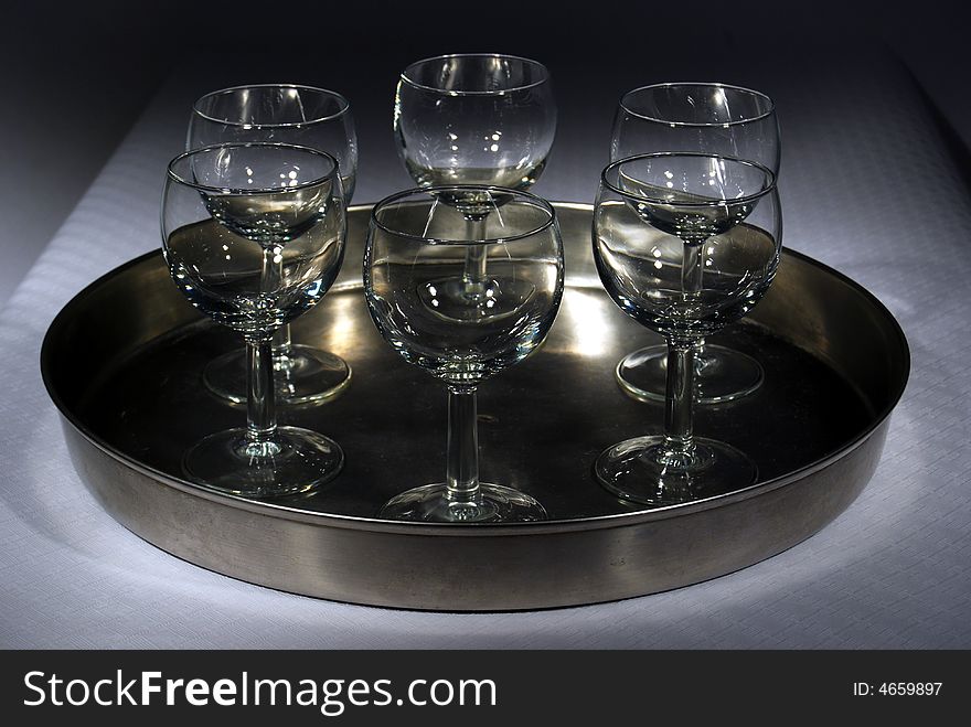 Glasses on a plate on a table